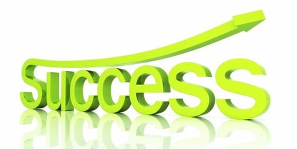 The word "Success" in bold green letters, with an upward arrow symbolising growth and achievement.
